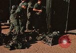 Image of unloading combat gear Vietnam, 1969, second 22 stock footage video 65675037300