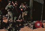 Image of unloading combat gear Vietnam, 1969, second 24 stock footage video 65675037300