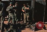 Image of unloading combat gear Vietnam, 1969, second 26 stock footage video 65675037300
