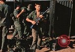 Image of unloading combat gear Vietnam, 1969, second 28 stock footage video 65675037300