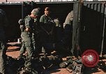 Image of unloading combat gear Vietnam, 1969, second 31 stock footage video 65675037300