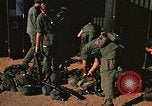 Image of unloading combat gear Vietnam, 1969, second 32 stock footage video 65675037300