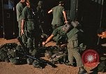 Image of unloading combat gear Vietnam, 1969, second 36 stock footage video 65675037300