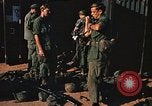 Image of unloading combat gear Vietnam, 1969, second 40 stock footage video 65675037300