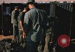 Image of unloading combat gear Vietnam, 1969, second 42 stock footage video 65675037300