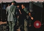 Image of unloading combat gear Vietnam, 1969, second 44 stock footage video 65675037300