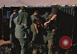 Image of unloading combat gear Vietnam, 1969, second 45 stock footage video 65675037300