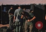 Image of unloading combat gear Vietnam, 1969, second 50 stock footage video 65675037300