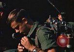 Image of unloading combat gear Vietnam, 1969, second 59 stock footage video 65675037300