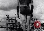 Image of prisoners swimming and playing Pacific theater, 1941, second 1 stock footage video 65675037310