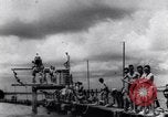Image of prisoners swimming and playing Pacific theater, 1941, second 3 stock footage video 65675037310