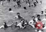 Image of prisoners swimming and playing Pacific theater, 1941, second 15 stock footage video 65675037310