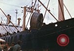 Image of loading of cargo onto a ship Saigon Vietnam, 1966, second 14 stock footage video 65675037333