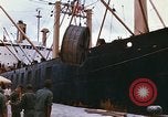 Image of loading of cargo onto a ship Saigon Vietnam, 1966, second 15 stock footage video 65675037333