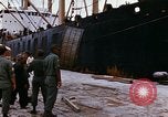 Image of loading of cargo onto a ship Saigon Vietnam, 1966, second 17 stock footage video 65675037333