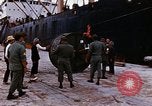 Image of loading of cargo onto a ship Saigon Vietnam, 1966, second 27 stock footage video 65675037333