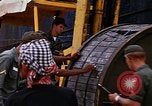 Image of loading of cargo onto a ship Saigon Vietnam, 1966, second 34 stock footage video 65675037333