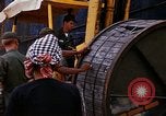 Image of loading of cargo onto a ship Saigon Vietnam, 1966, second 36 stock footage video 65675037333