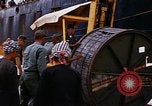 Image of loading of cargo onto a ship Saigon Vietnam, 1966, second 40 stock footage video 65675037333