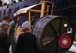 Image of loading of cargo onto a ship Saigon Vietnam, 1966, second 41 stock footage video 65675037333