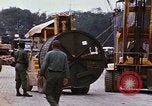 Image of loading of cargo onto a ship Saigon Vietnam, 1966, second 50 stock footage video 65675037333