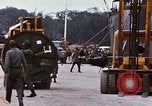 Image of loading of cargo onto a ship Saigon Vietnam, 1966, second 53 stock footage video 65675037333