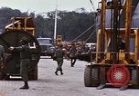 Image of loading of cargo onto a ship Saigon Vietnam, 1966, second 54 stock footage video 65675037333
