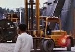 Image of loading of cargo onto a ship Saigon Vietnam, 1966, second 58 stock footage video 65675037333