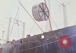Image of loading of cargo onto a ship Saigon Vietnam, 1966, second 59 stock footage video 65675037333