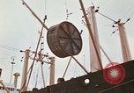 Image of loading of cargo onto a ship Saigon Vietnam, 1966, second 60 stock footage video 65675037333