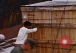 Image of unloading carrier vehicle Saigon Vietnam, 1966, second 25 stock footage video 65675037334