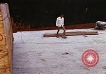 Image of unloading carrier vehicle Saigon Vietnam, 1966, second 49 stock footage video 65675037334