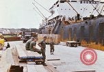 Image of unloading carrier vehicle Saigon Vietnam, 1966, second 62 stock footage video 65675037334