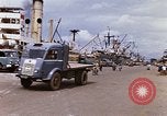 Image of Unloading of oil barrels Saigon Vietnam, 1966, second 7 stock footage video 65675037335