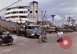 Image of Unloading of oil barrels Saigon Vietnam, 1966, second 14 stock footage video 65675037335