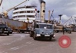 Image of Unloading of oil barrels Saigon Vietnam, 1966, second 17 stock footage video 65675037335