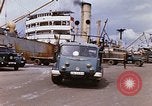 Image of Unloading of oil barrels Saigon Vietnam, 1966, second 18 stock footage video 65675037335