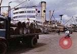 Image of Unloading of oil barrels Saigon Vietnam, 1966, second 20 stock footage video 65675037335