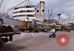 Image of Unloading of oil barrels Saigon Vietnam, 1966, second 21 stock footage video 65675037335