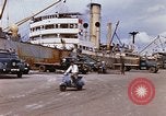Image of Unloading of oil barrels Saigon Vietnam, 1966, second 22 stock footage video 65675037335