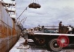 Image of Unloading of oil barrels Saigon Vietnam, 1966, second 24 stock footage video 65675037335