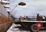 Image of Unloading of oil barrels Saigon Vietnam, 1966, second 26 stock footage video 65675037335