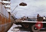Image of Unloading of oil barrels Saigon Vietnam, 1966, second 27 stock footage video 65675037335