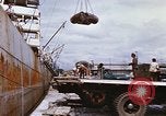 Image of Unloading of oil barrels Saigon Vietnam, 1966, second 28 stock footage video 65675037335