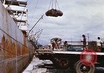 Image of Unloading of oil barrels Saigon Vietnam, 1966, second 29 stock footage video 65675037335