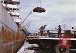 Image of Unloading of oil barrels Saigon Vietnam, 1966, second 30 stock footage video 65675037335