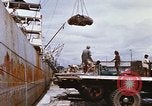 Image of Unloading of oil barrels Saigon Vietnam, 1966, second 31 stock footage video 65675037335