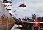 Image of Unloading of oil barrels Saigon Vietnam, 1966, second 35 stock footage video 65675037335