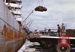 Image of Unloading of oil barrels Saigon Vietnam, 1966, second 36 stock footage video 65675037335
