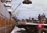 Image of Unloading of oil barrels Saigon Vietnam, 1966, second 38 stock footage video 65675037335